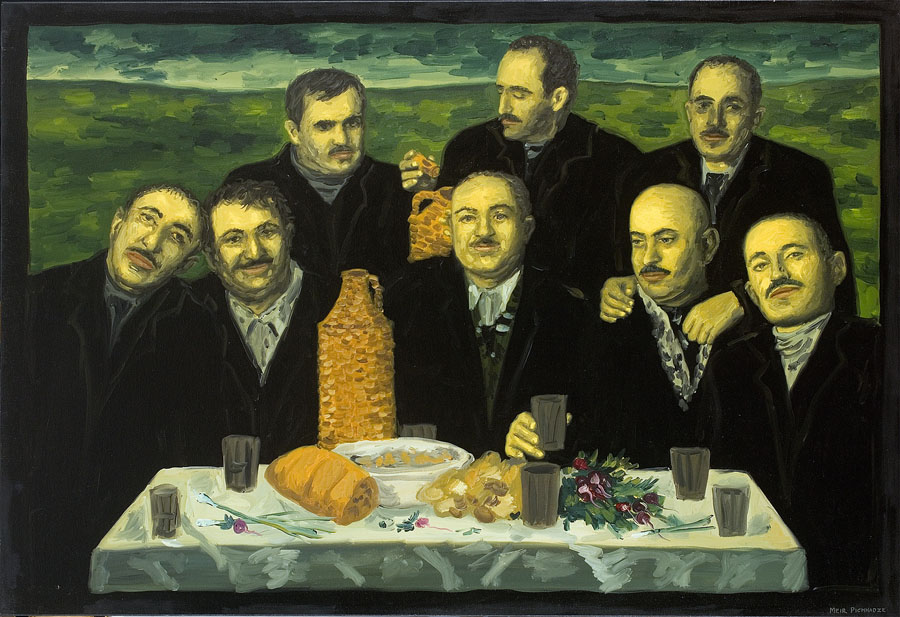 Men in suits, table with food